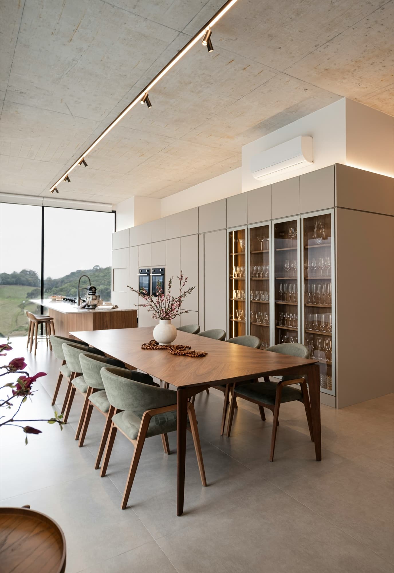 Open dining and kitchen wing bathed in daylight