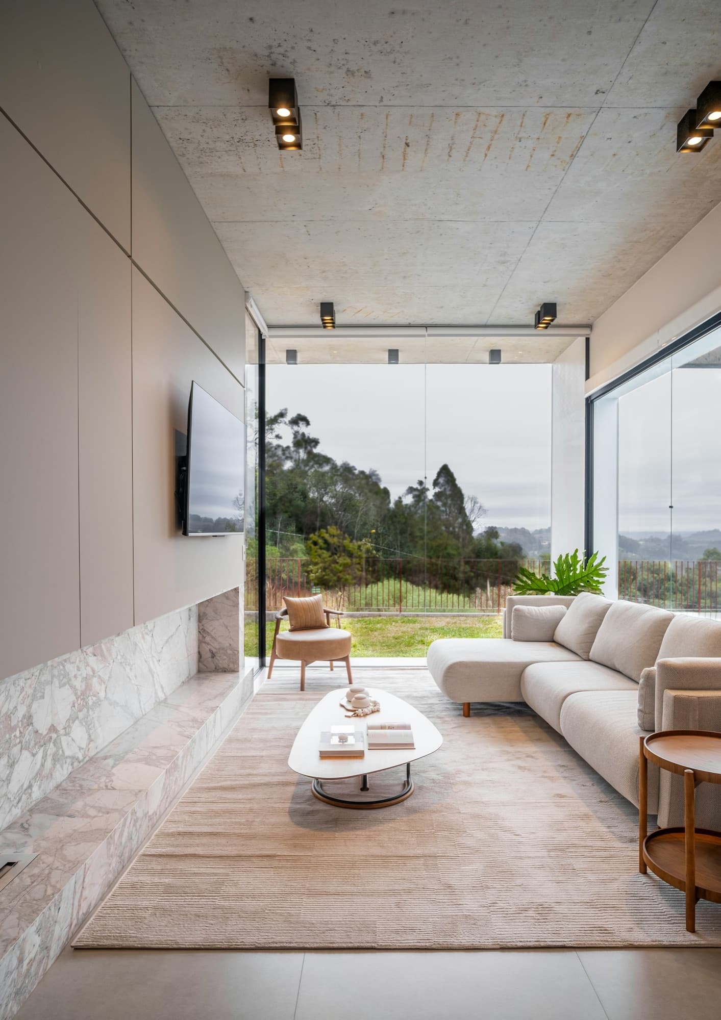 Sunken living room framed by a panoramic window