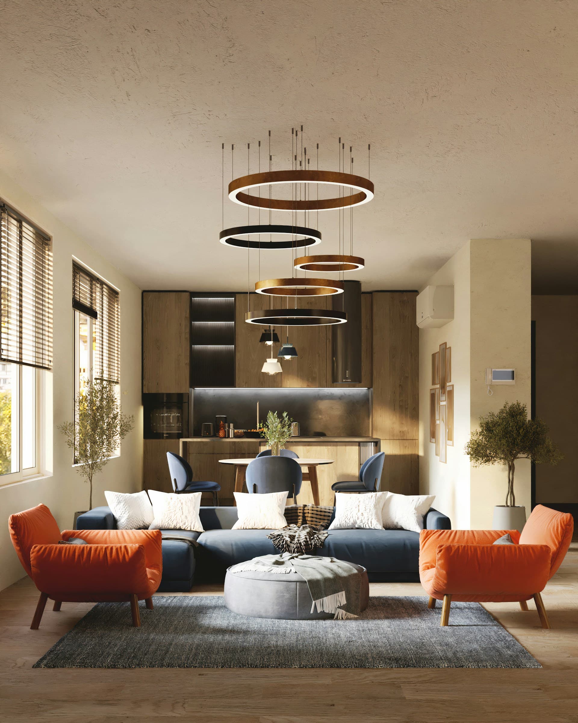 Living room with burnt orange armchairs and ring chandelier