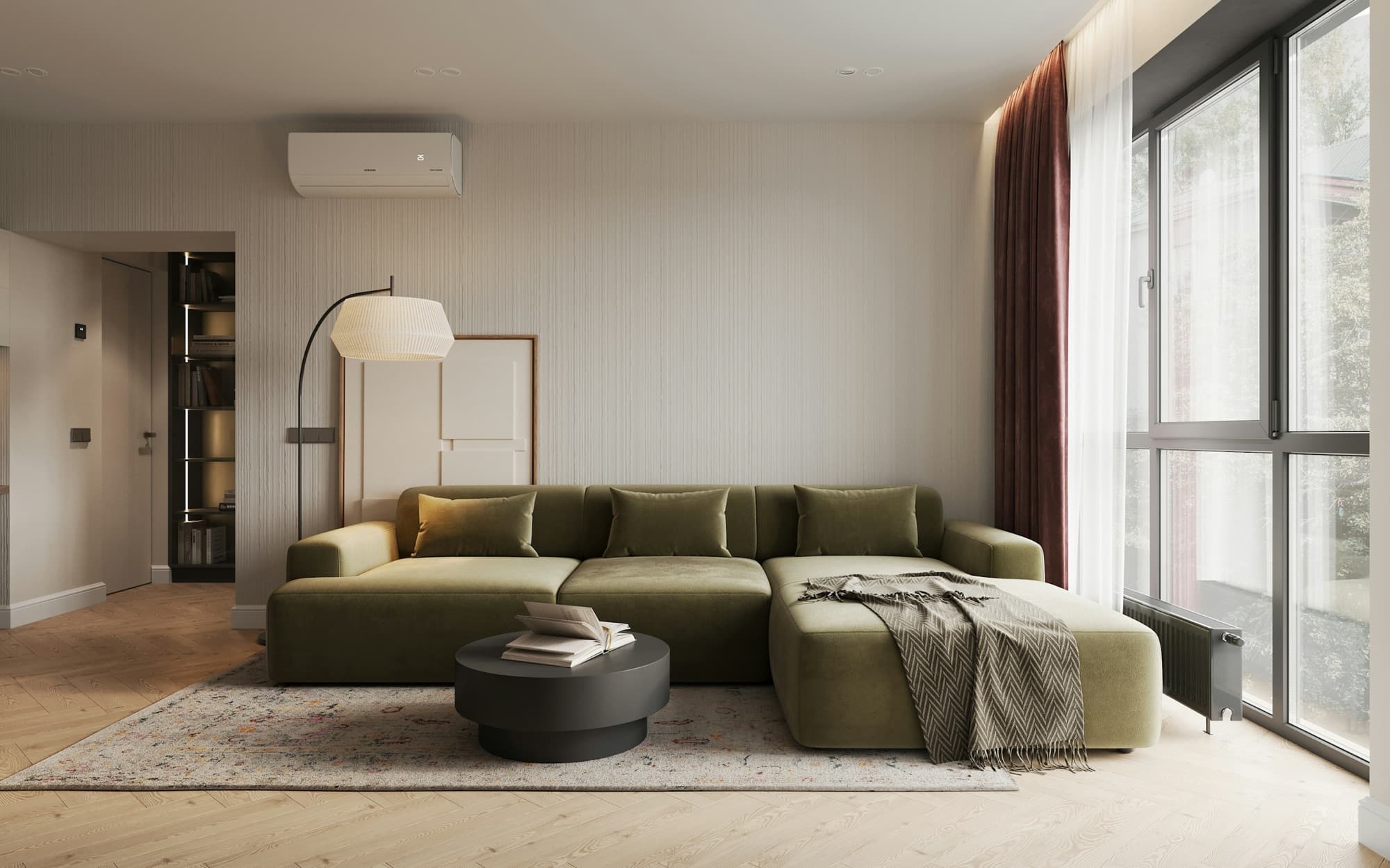 Minimal living room with an olive velvet corner sofa and paper floor lamp